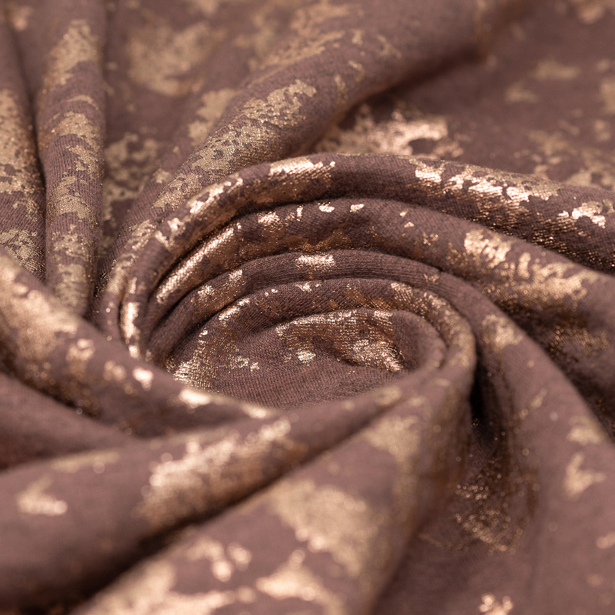 Swirled sample shot of Cloud 9 Foil Printed Brushed Terry Fleece in the color Mauve/Rose Gold