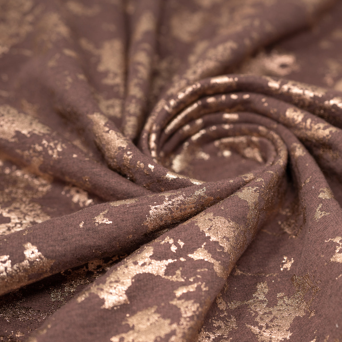 Swirled sample shot of Cloud 9 Foil Printed Brushed Terry Fleece in the color Mauve/Rose Gold