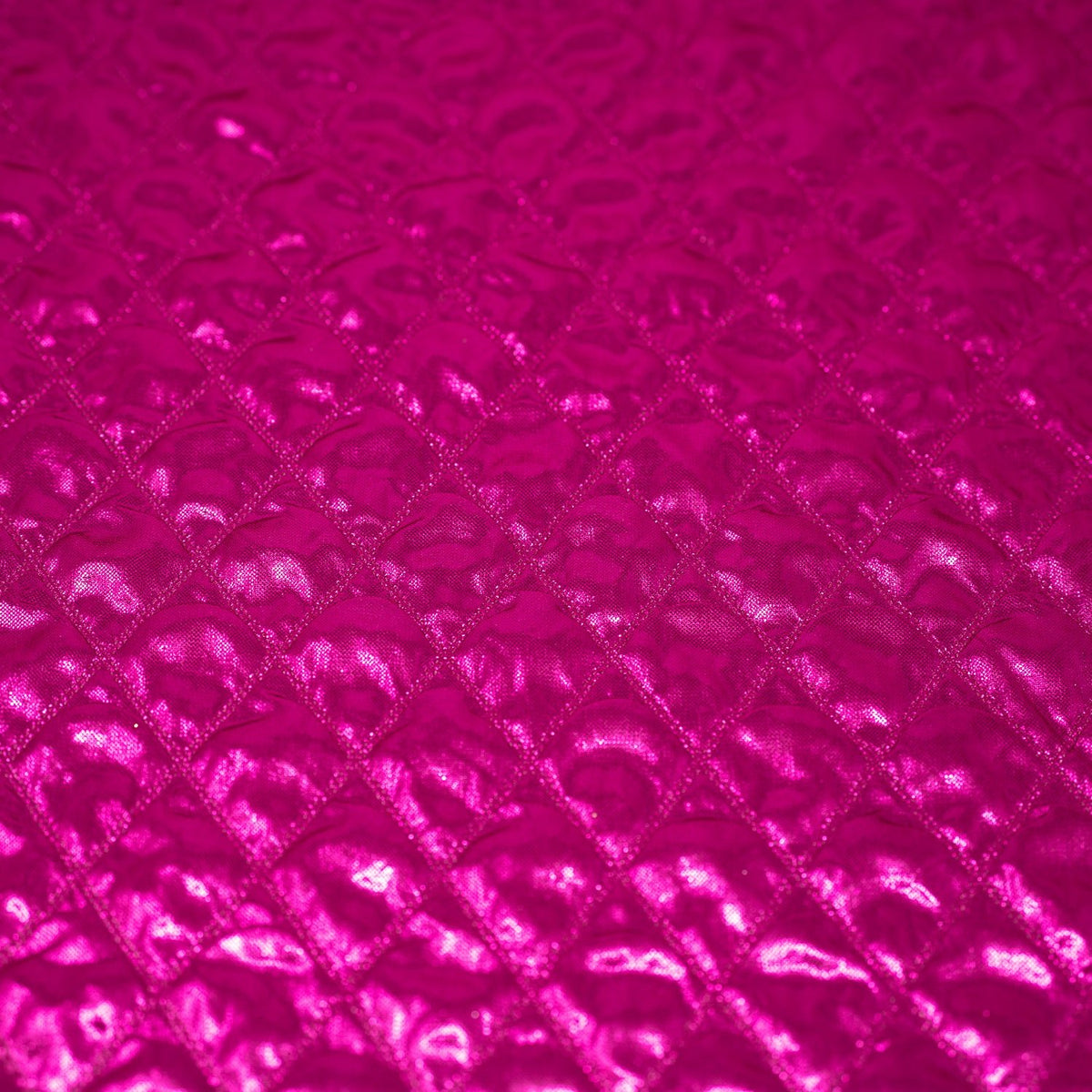 Detailed shot of Betty Embossed Metallic Polyester in Fuchsia.