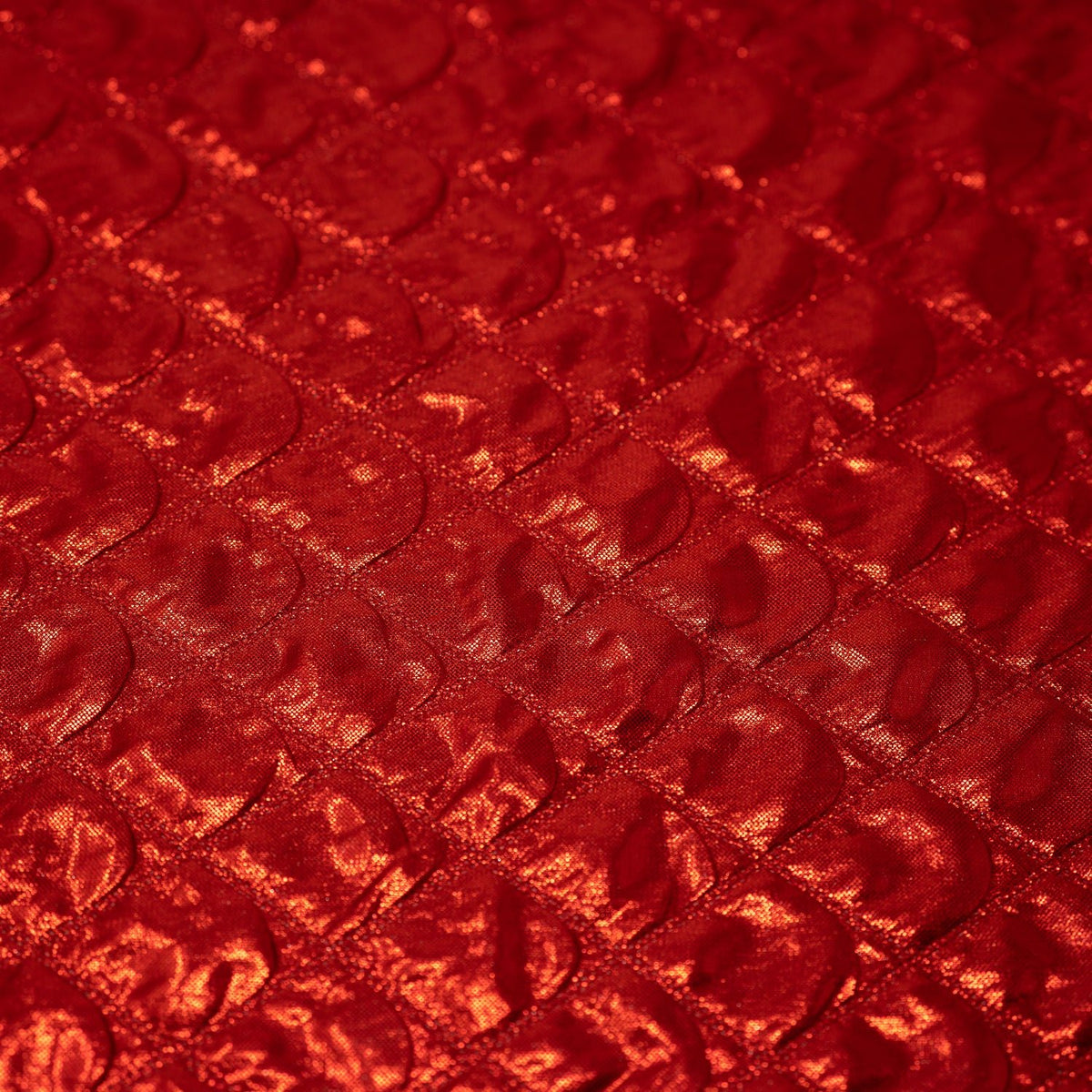 Detailed shot of Betty Embossed Metallic Polyester in Red.