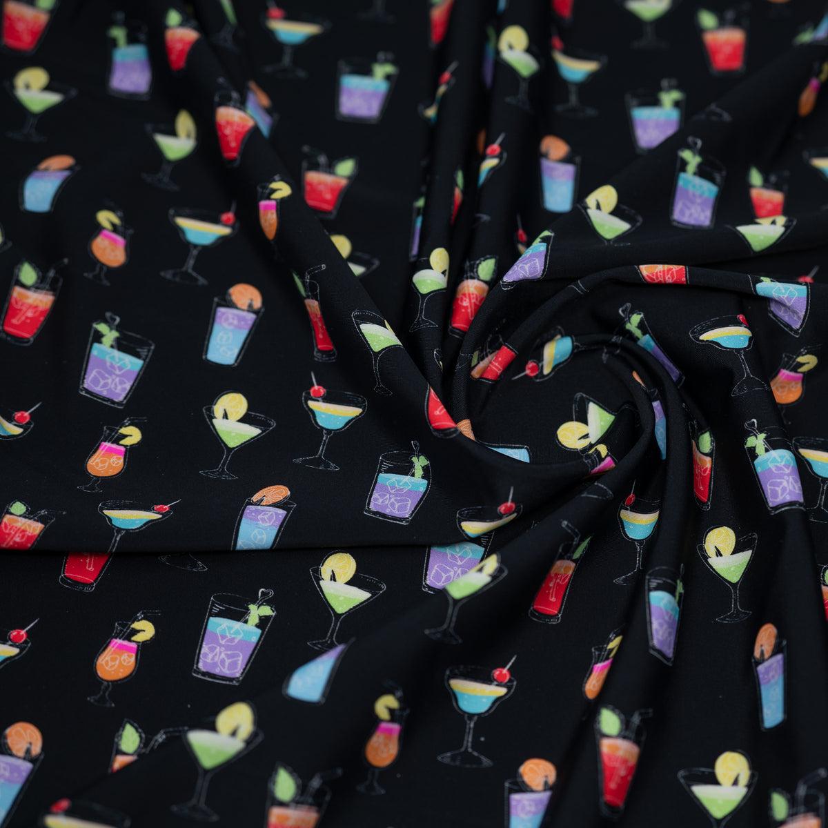 A swirled piece of Cocktail Hour Printed Spandex.