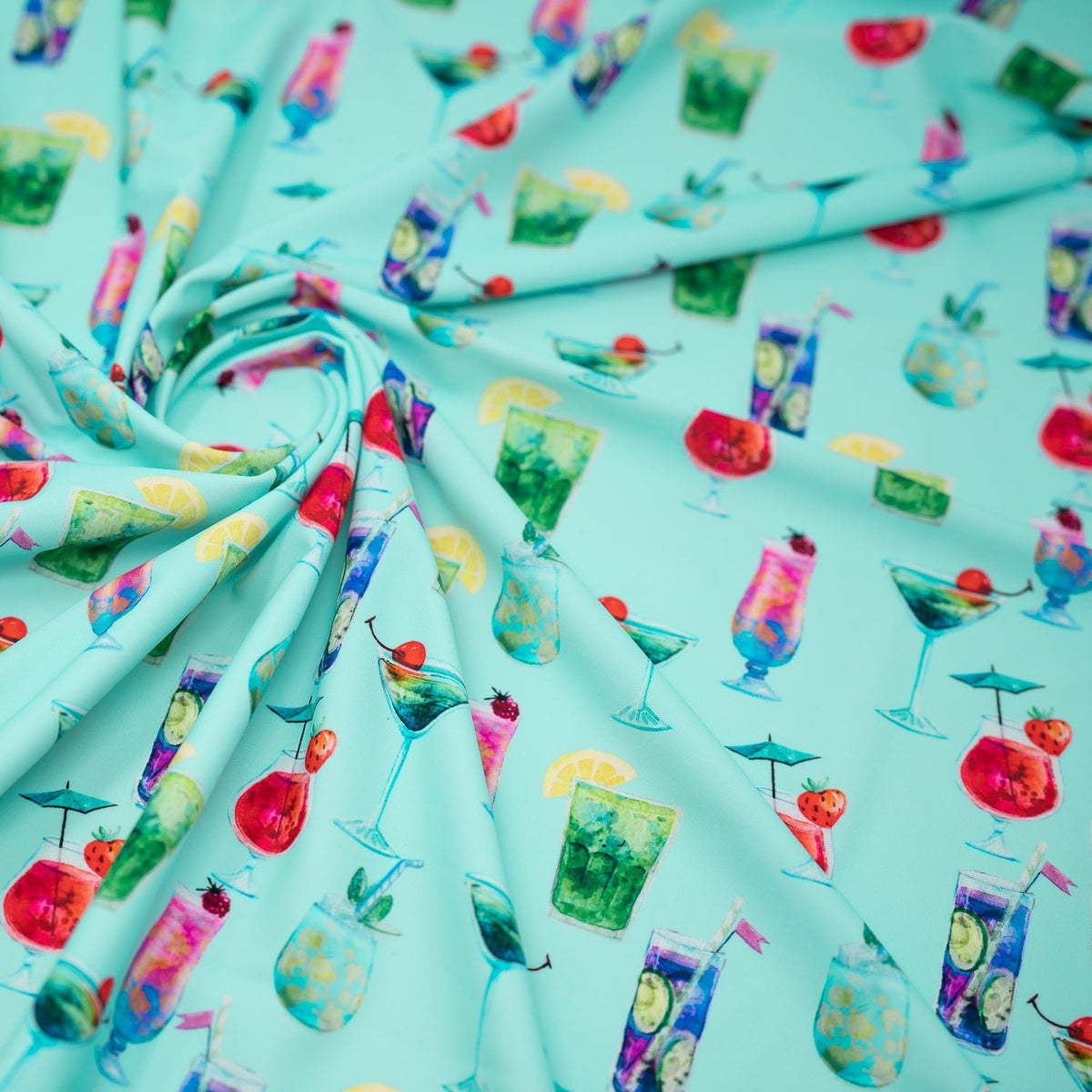 A swirled piece of Drink Me Printed Spandex.