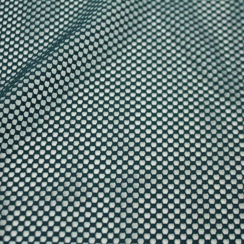 A flat sample of forte flair mesh in the color pine.
