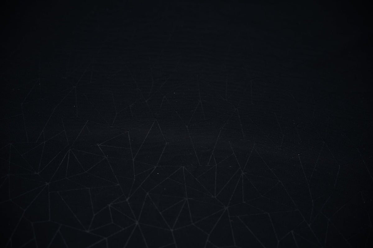 Detailed shot of Geometric Embossed Matte Spandex Tricot in Black.