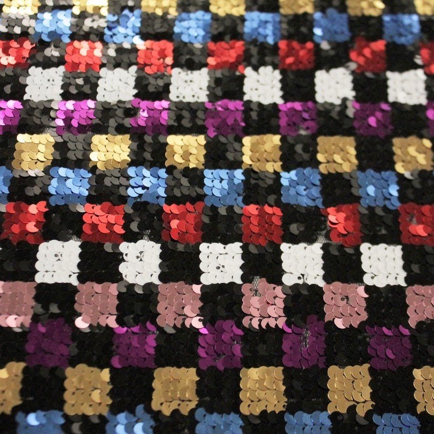 A flat sample of glistenup stretch mesh sequin.