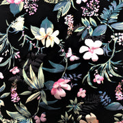 A flat sample of lotus printed spandex with all over foil.