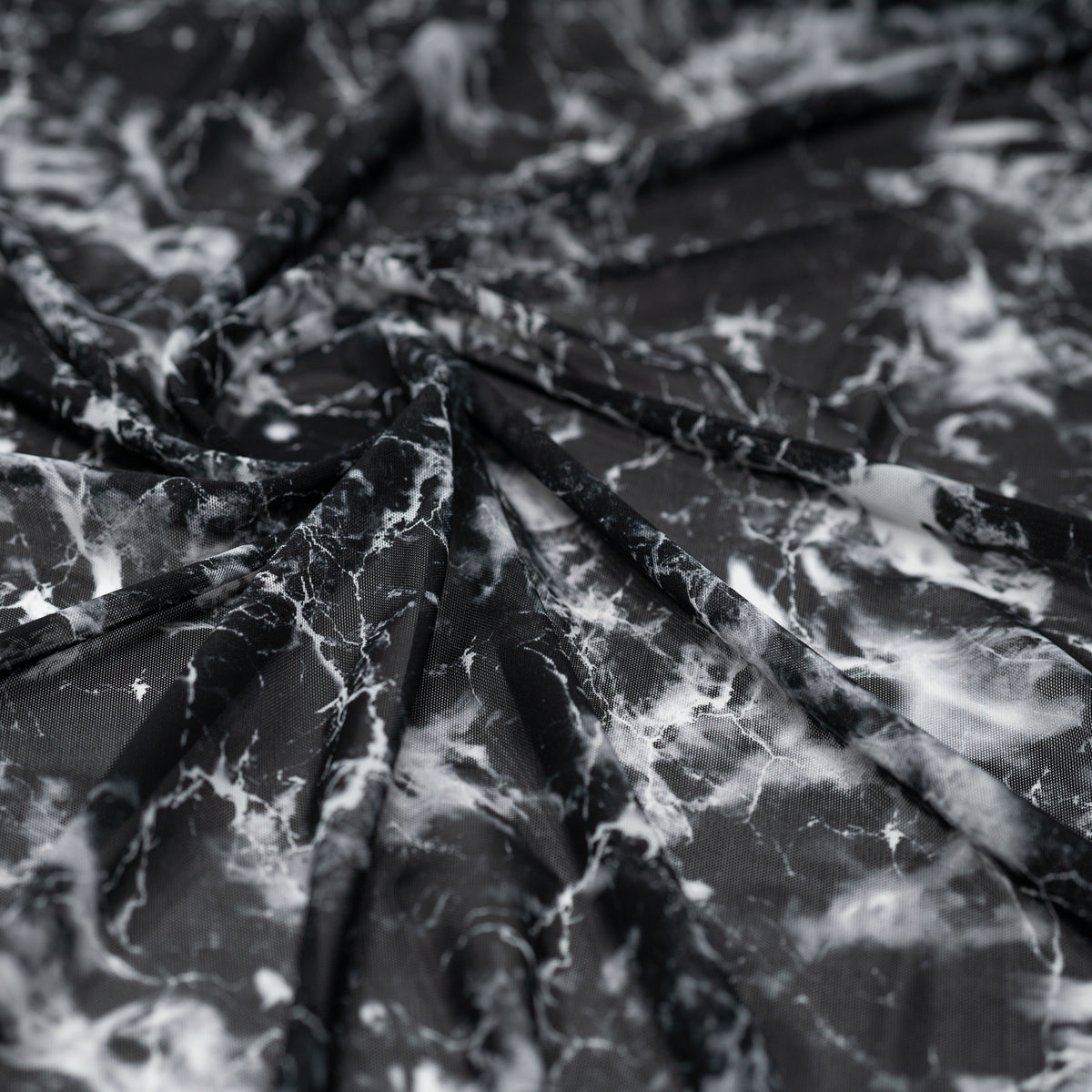 Swirled sample shot of Magic Marble Printed Power Mesh
