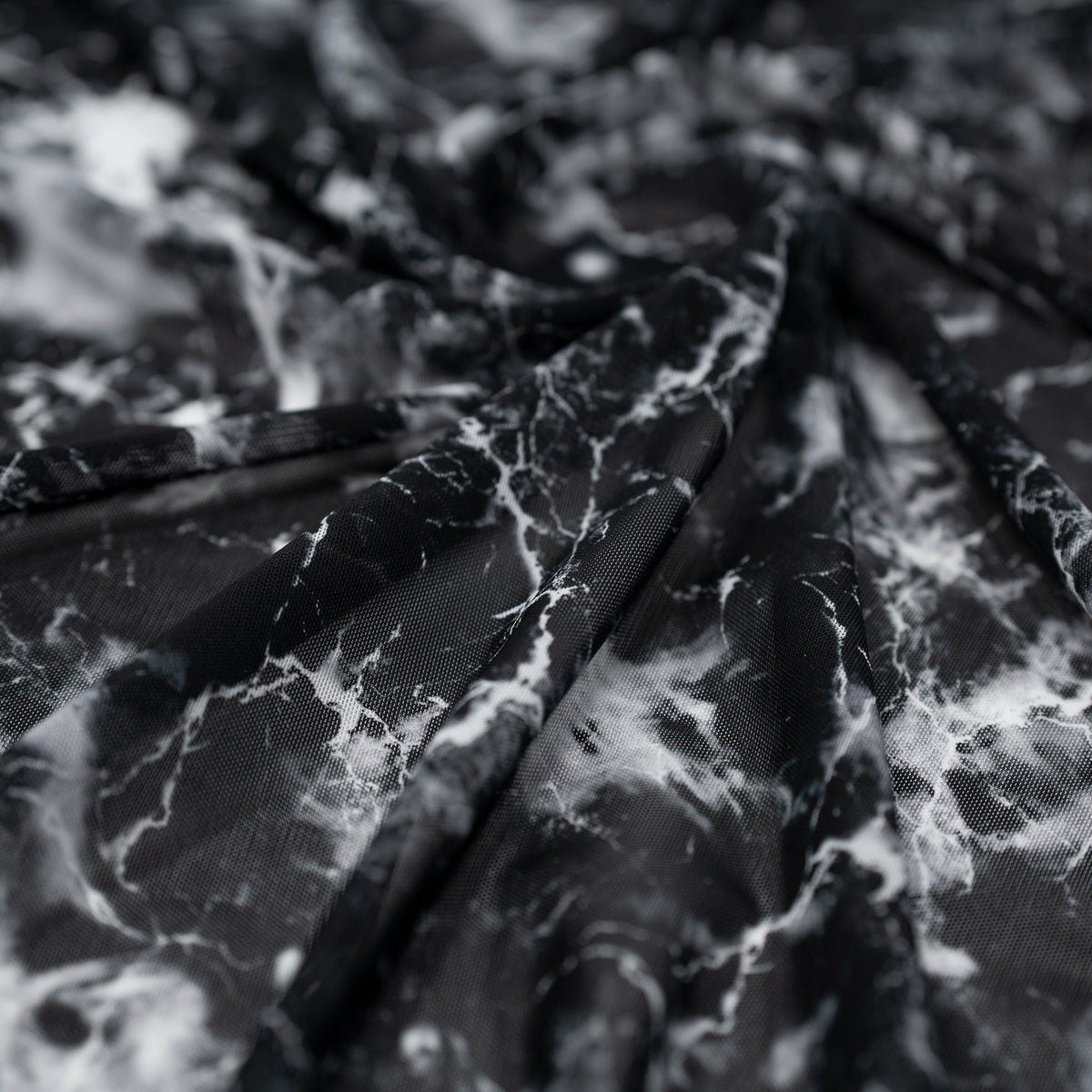 Swirled sample shot of Magic Marble Printed Power Mesh