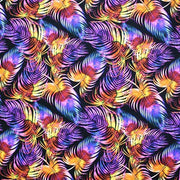 A flat sample of rainbow palms leaves printed spandex.