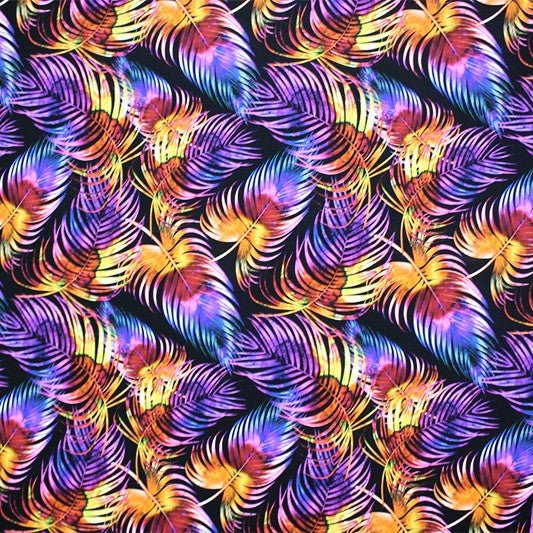 A flat sample of rainbow palms leaves printed spandex.
