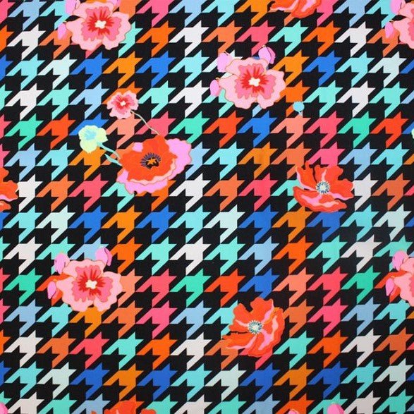 A flat sample of floating poppies printed spandex.