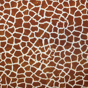 A flat sample of giraffe printed spandex.