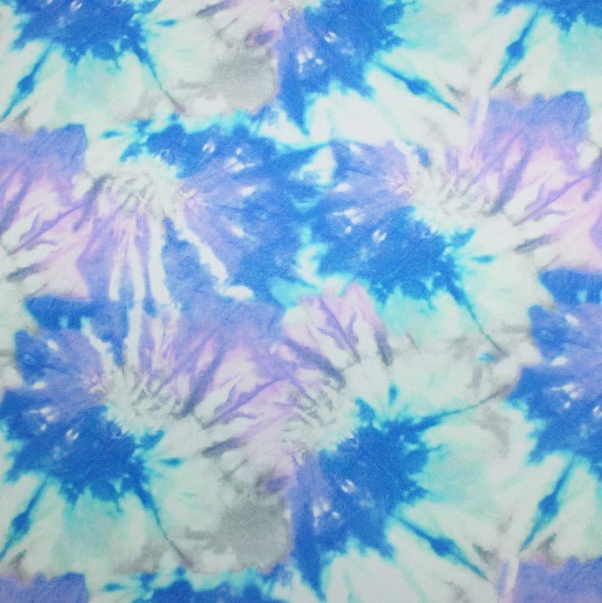 A flat sample of blue skies printed spandex.