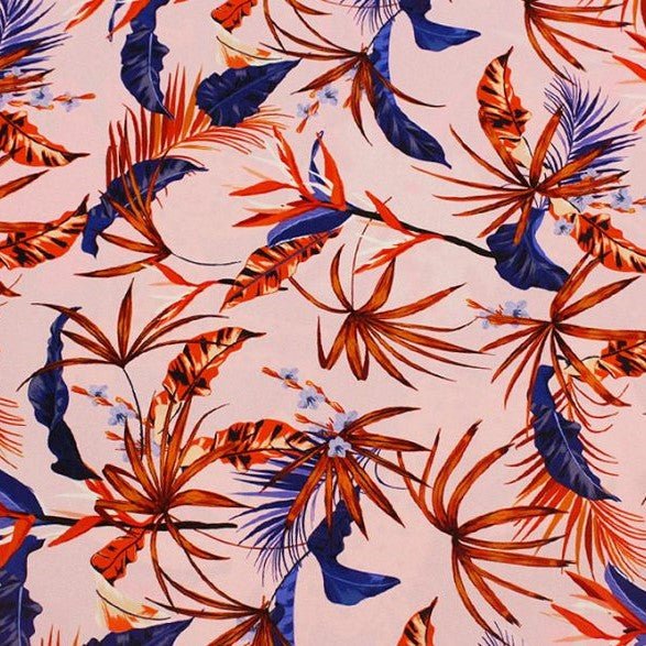 A flat sample of red fan palms printed spandex.