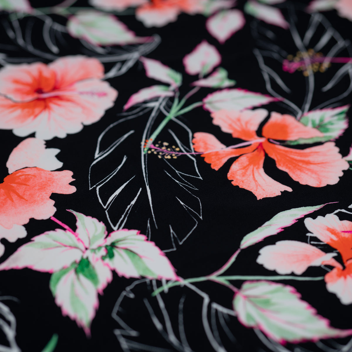 Detailed shot of Hibiscus Flowers on Black Printed Spandex.