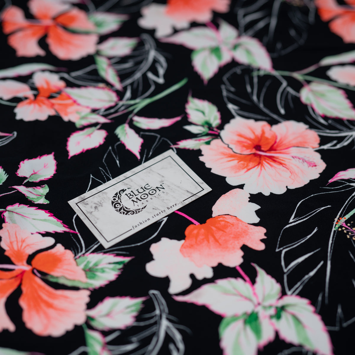 Detailed shot of Hibiscus Flowers on Black Printed Spandex.