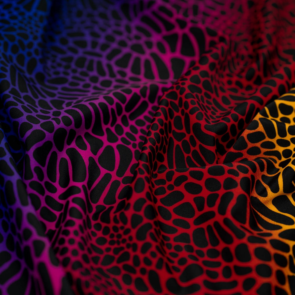 A crumpled piece of Multicolor Safari Spots Printed Spandex