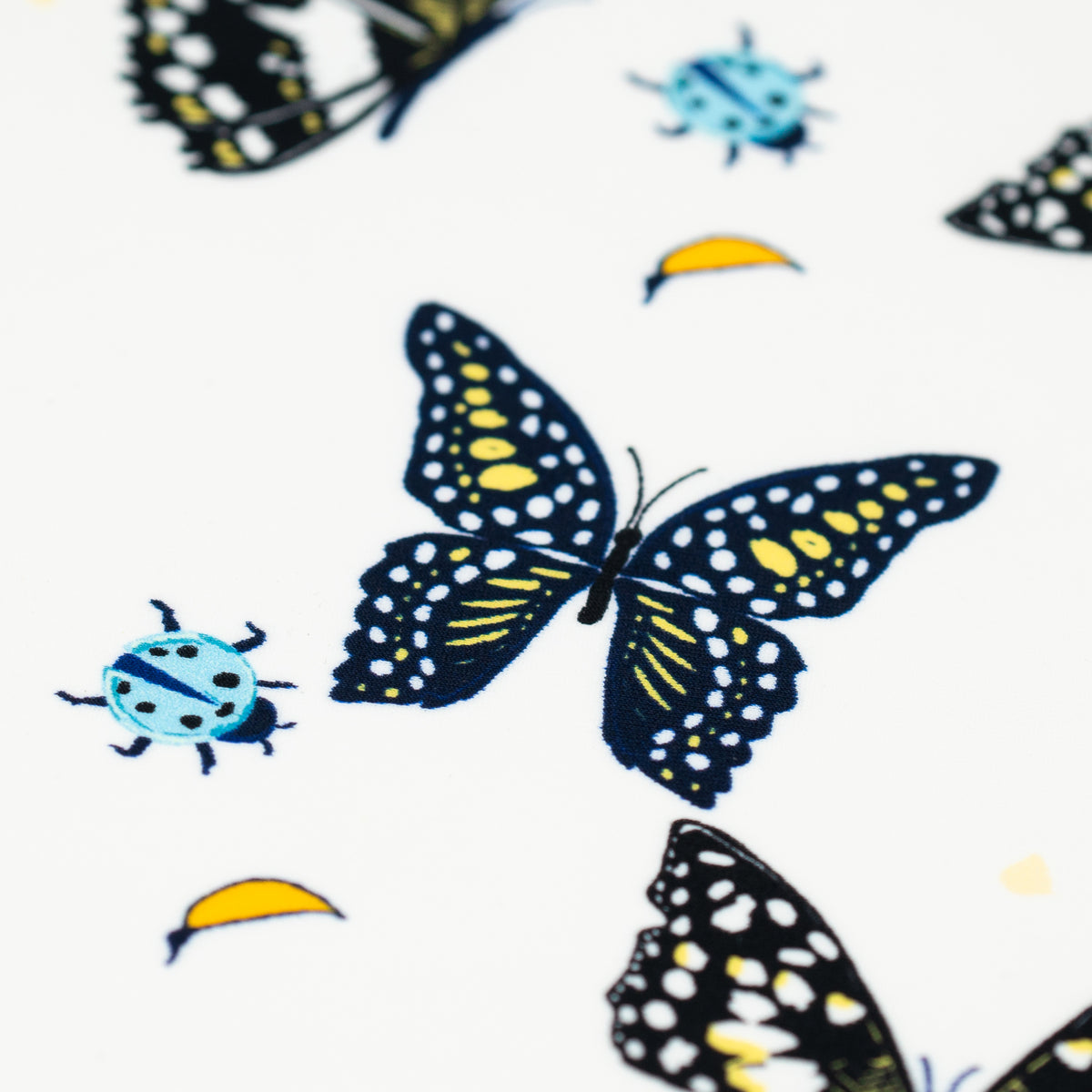 A flat sample of Butterflies and Ladybugs Printed Spandex