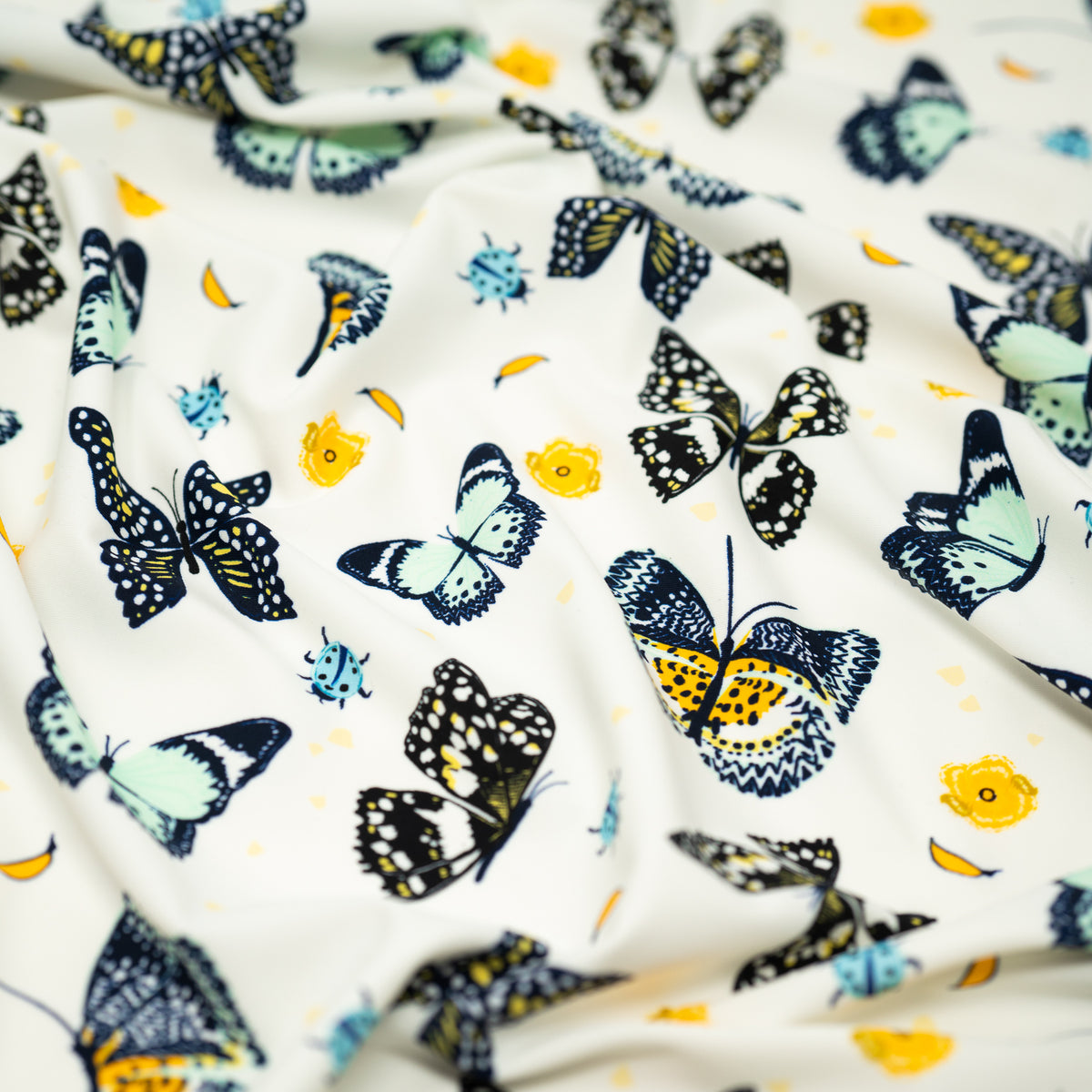 A crumpled piece of Butterflies and Ladybugs Printed Spandex