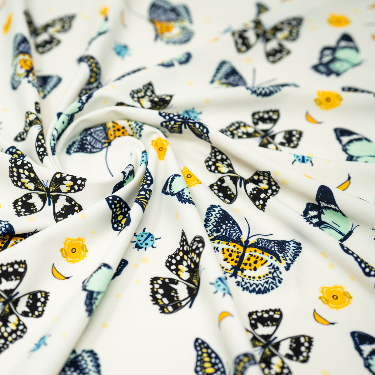 A swirled piece of Butterflies and Ladybugs Printed Spandex