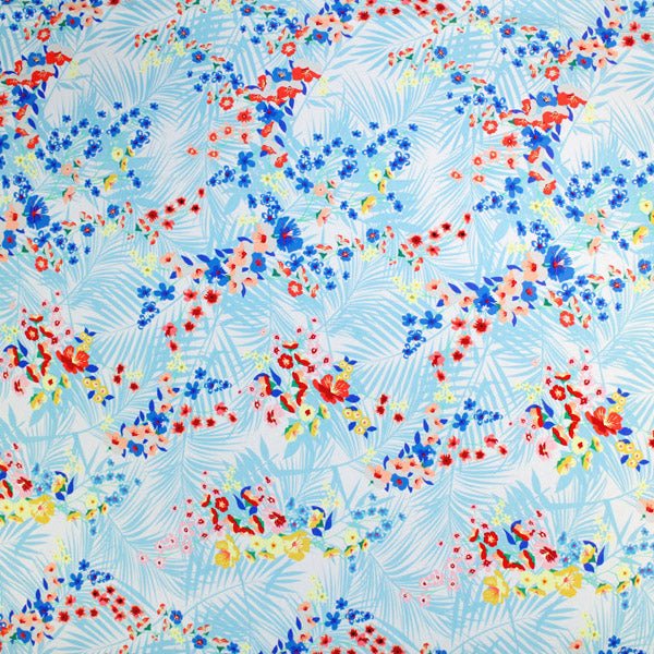 A flat sample of Autumn Palms and Pretty Flowers Printed Spandex.