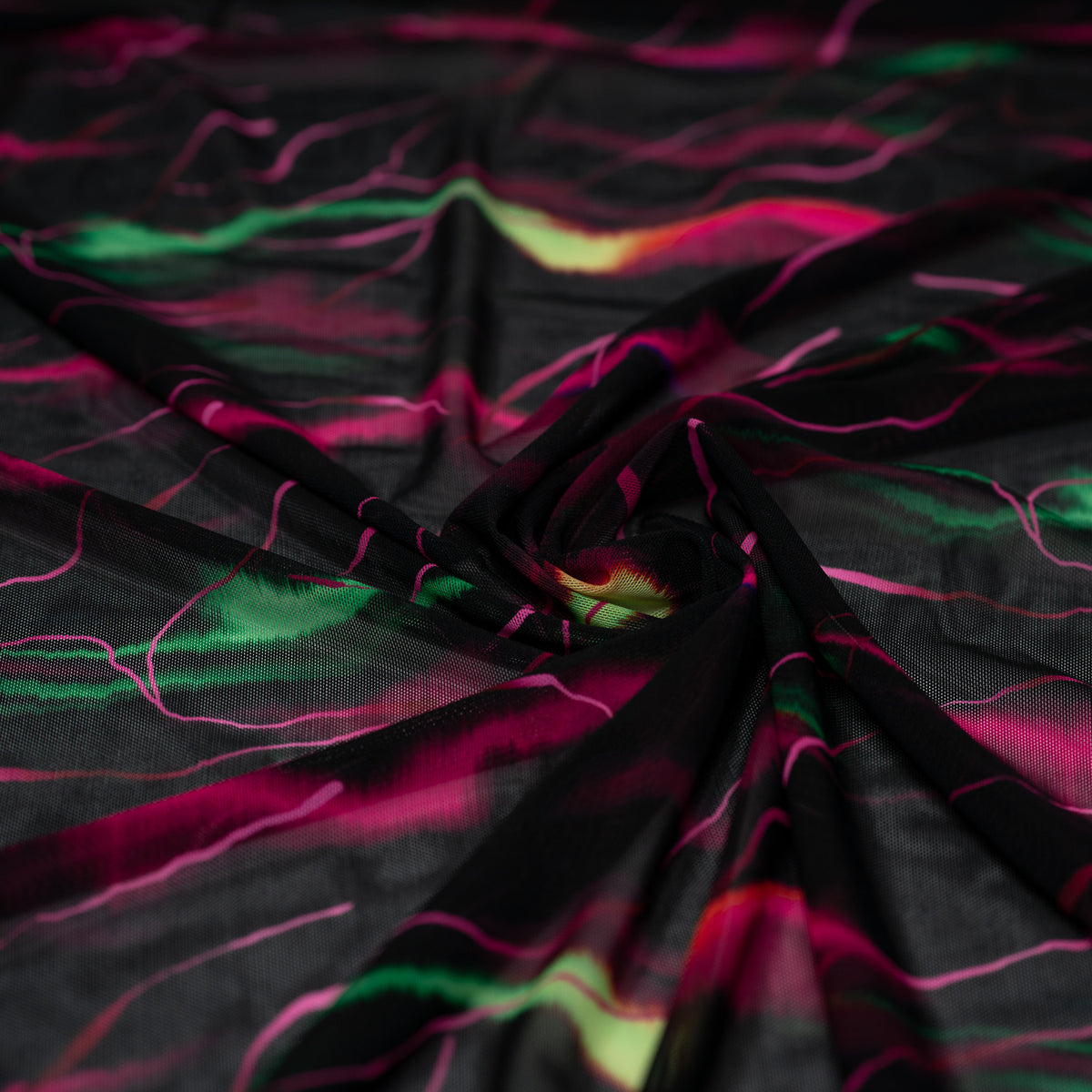 A swirled piece of Neon Northern Lights Printed Power Mesh