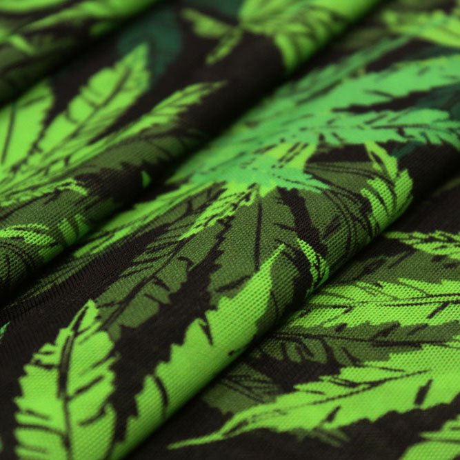 A flat sample of canabis leaf printed power mesh.