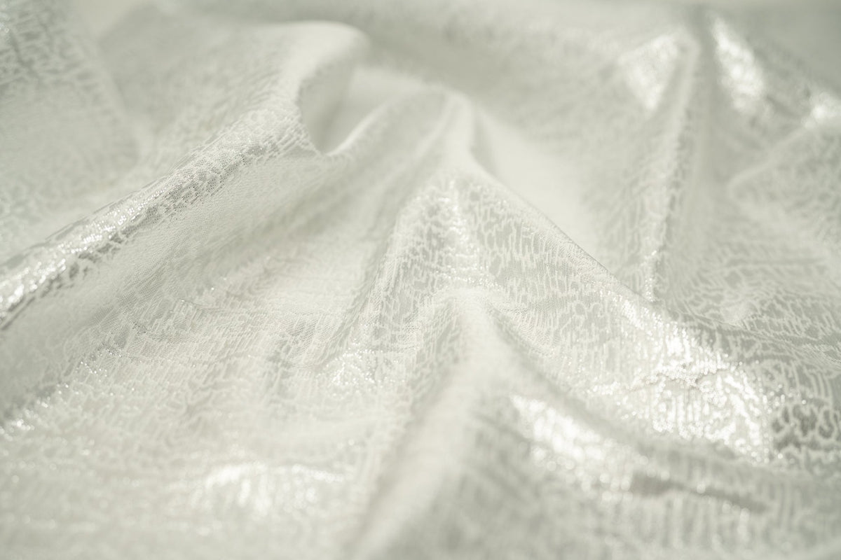 Detailed shot of Snow Storm Metallic Brocade.