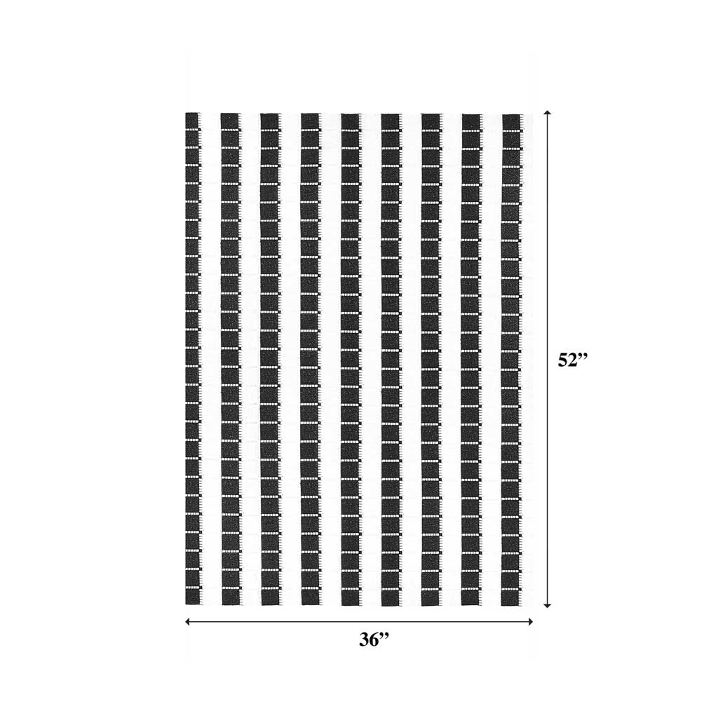 A measured draped sample of spade mechanical lace in the color black and white.