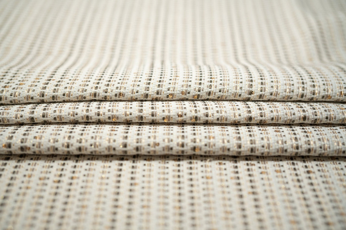 Detailed shot of White and Gold Weave Metallic Brocade.