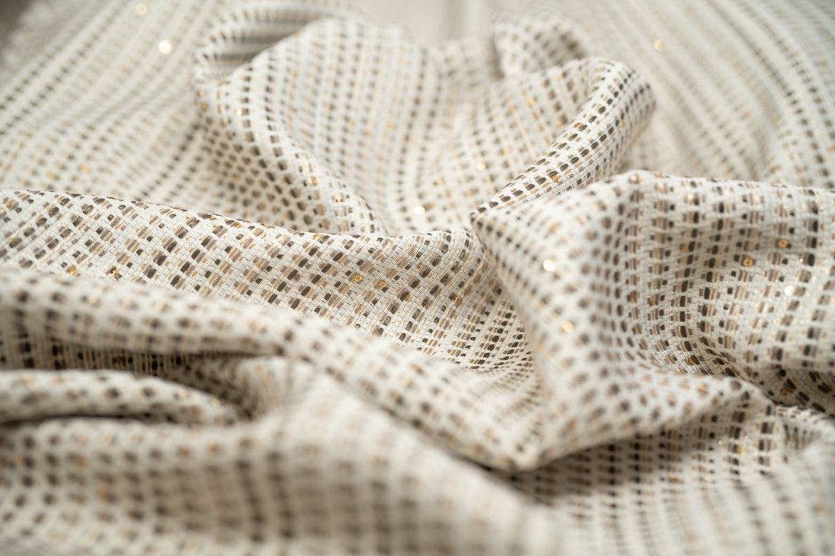 Detailed shot of White and Gold Weave Metallic Brocade.