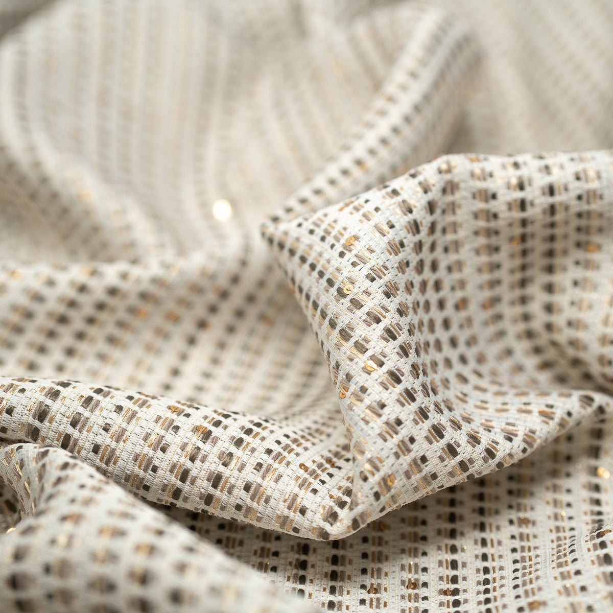 Detailed shot of White and Gold Weave Metallic Brocade.