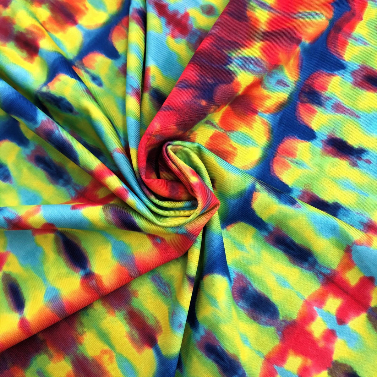 A swirled piece of double-sided tie-dye and stars polyester printed spandex.
